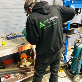 Auramotive Mechanical Personel fixing vehicle parts.