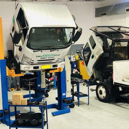 trucks for repair in auramotive mechanical shop